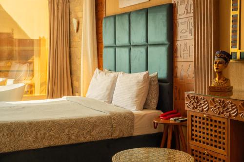 Un ou plusieurs lits dans un hébergement de l'établissement Jimmy Pyramids Hotel