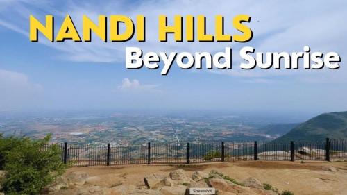 a sign that reads nambil hills beyond sunrise at ZIONS AIRPORT HOTEL AND APERTMENT! Near Kempegowda International Airport in Bengaluru