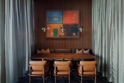 a dining room with a table and chairs at One Fukuoka Hotel in Fukuoka