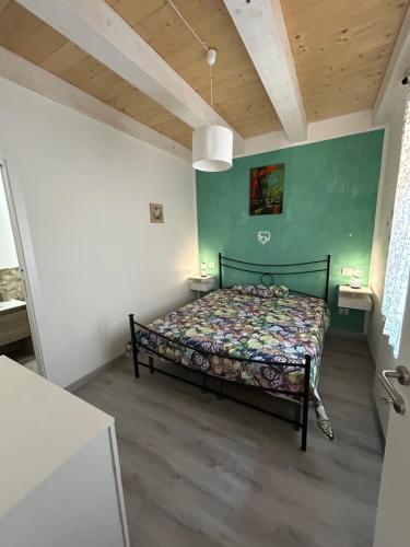 Postel nebo postele na pokoji v ubytování Il paradiso delle farfalle