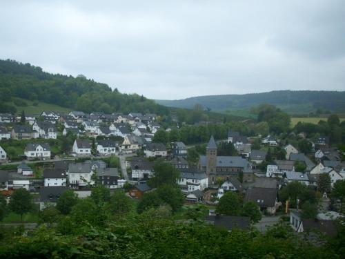 a town in the hills with houses and trees at Gasthof Susewind in Antfeld