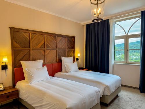 a hotel room with two beds and a window at AGARANI Estate in Tʼelavi