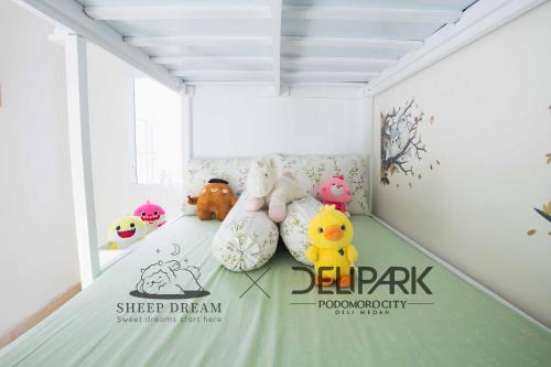 a room with stuffed animals sitting on a floor at Delipark Mall 2 Bedrooms 1 Bathroom 4-6 Pax Liberty Tower Level 9 in Medan