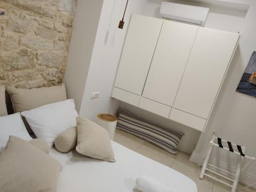 A bed or beds in a room at Candia Strada
