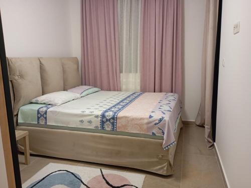 Postel nebo postele na pokoji v ubytování Nikoleta Apartman