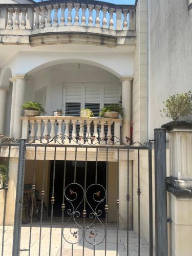 a house with a balcony with potted plants on it at Casa Ludogiú in Scorrano
