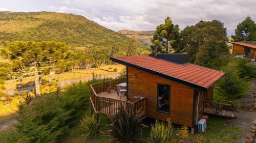 an aerial view of a cabin with a deck at Cascata dos Amores in Urubici