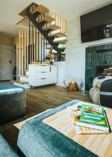 a living room with a couch and a table at Yama Krywe in Krywe