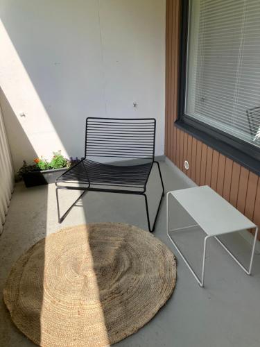 a bench and a table on a porch at Yksiö Asemakadulla in Lapua