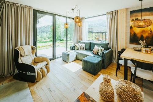 a living room with a couch and a table at Yama Krywe in Krywe