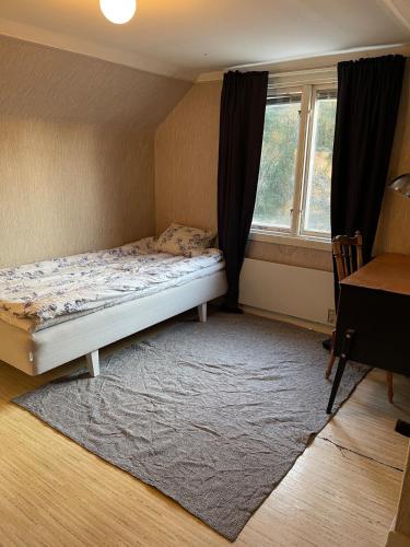 Una cama o camas en una habitación de Mysigt torp på landet