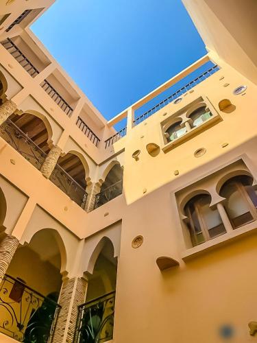 a building with balconies on the side of it at Riad Noor in Agadir