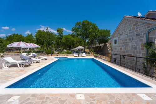 Villa Lugareva with 52 sqm private pool, 4 bedrooms, 4 bathrooms, summer kitchen, traditional environment, playground