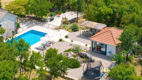 Villa Lugareva with 52 sqm private pool, 4 bedrooms, 4 bathrooms, summer kitchen, traditional environment, playground
