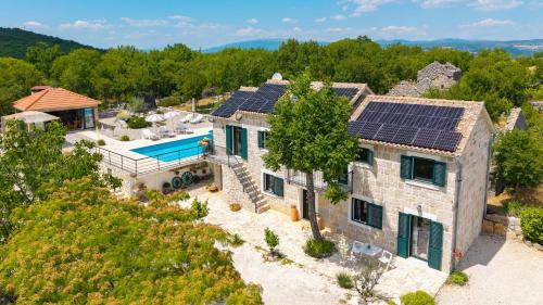 Villa Lugareva with 52 sqm private pool, 4 bedrooms, 4 bathrooms, summer kitchen, traditional environment, playground