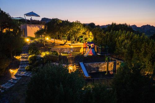 an aerial view of a playground at night at VILLA AMIRA Porto Cervo con vista Mozzafiato sul Mare,Piscina Privata,WELLNESS & SPA in Liscia di Vacca