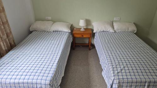 Apartment in Rota Cadiz, terrace AC wifiにあるベッド