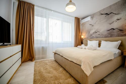 Postel nebo postele na pokoji v ubytování Retreat on Victoriei