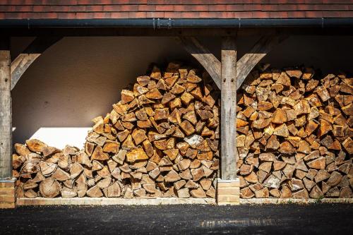 a pile of fire wood in a building at Kingsley House in Haslemere