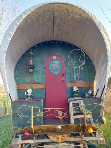 a train car with a door in a tunnel at Jardin Rêveur la cabane La tête dans les étoiles in Gesves