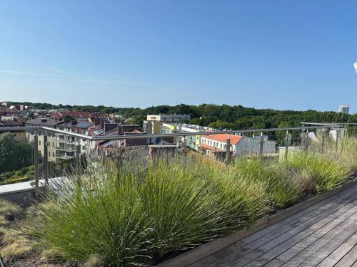 a view of a city from a wooden deck at Apartamenty Rondo in Świnoujście