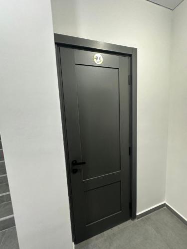 a door with a sign on it in a room at Hotel black sea in K'obulet'i