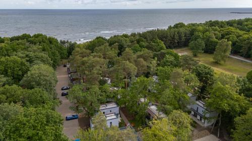 an aerial view of a park next to the water at Baltic Forest in Kołobrzeg