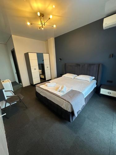 a bedroom with a large bed in a room at Hotel black sea in K'obulet'i