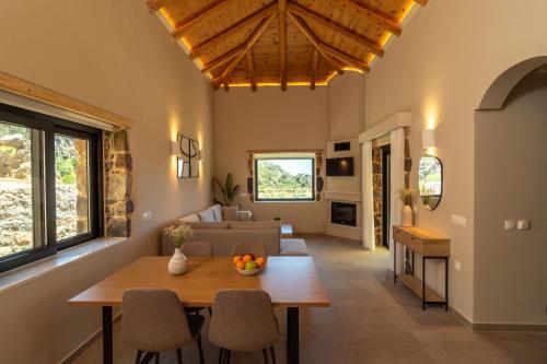 a living room with a table and a couch at Aoria Villas in Palaiochóra