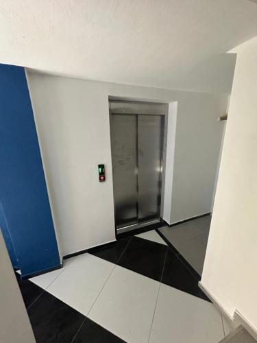 an empty room with a hallway with a elevator at Hotel black sea in K'obulet'i