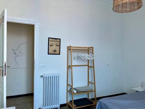 a room with a ladder and a blue wall at Casa Enrico in Alassio