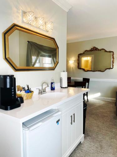 a bathroom with a sink and a mirror at Lowell Inn in Stillwater