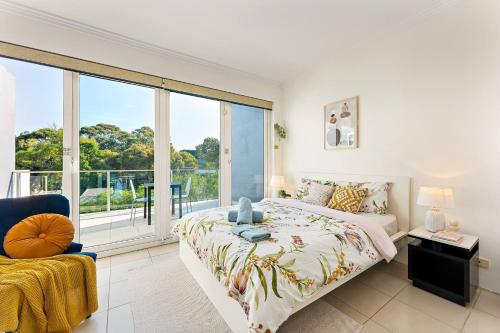 a bedroom with a bed and a large window at Fantastic stay-walk to darling harbour&fish market in Sydney