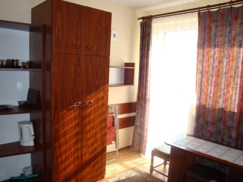 Kuchyň nebo kuchyňský kout v ubytování Pokoje Gościnne AMBER