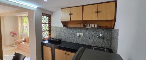 Kuchyň nebo kuchyňský kout v ubytování Rosean Homestay Self Service Apartments