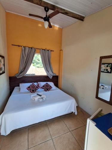 Postel nebo postele na pokoji v ubytování Suítes Praia das Toninhas