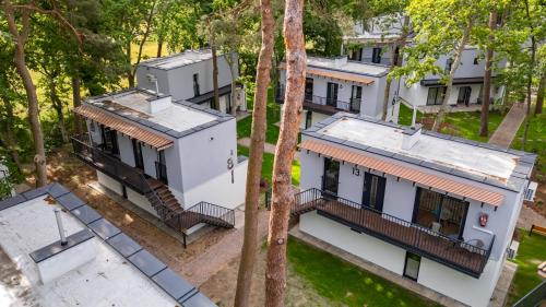 an overhead view of a house with trees at Baltic Forest in Kołobrzeg