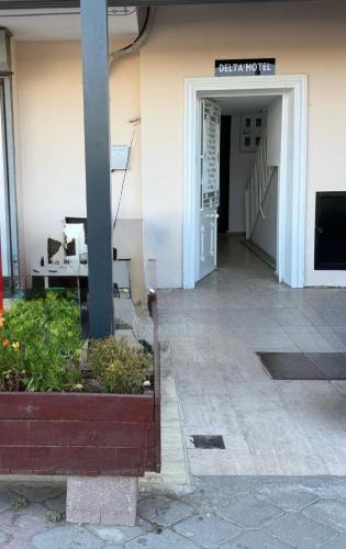 a entrance to a building with a sign on the wall at Hotel Delta in Fethiye