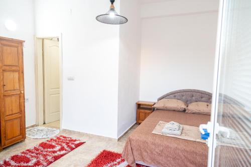 a bedroom with a bed and a mirror at Villa Serenita in Ulcinj