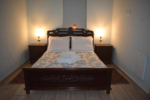a bedroom with a bed with two towels on it at Περγαμόντο in Chios