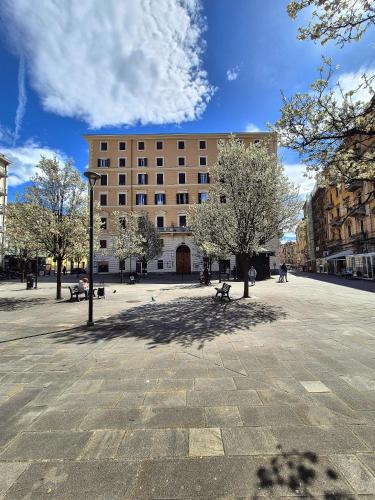 a large building in the middle of a street at Cinque Terre Bridge in La Spezia