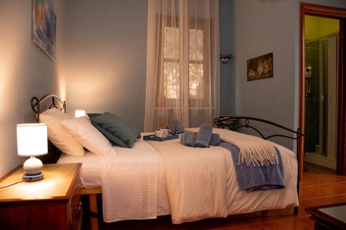 a bedroom with a bed with towels on it at The Oaks in Spigno Saturnia