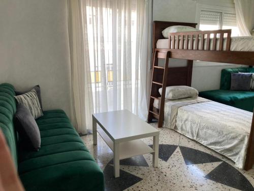 a living room with a couch and a bunk bed at Tetuán 2025 in Tetouan