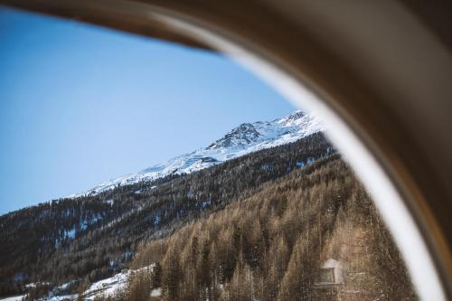a view of a mountain from an airplane window at Pension Neururer in Sölden