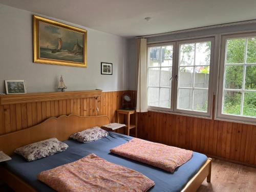 a bedroom with two beds and a window at Anker Kotwica in Łeba