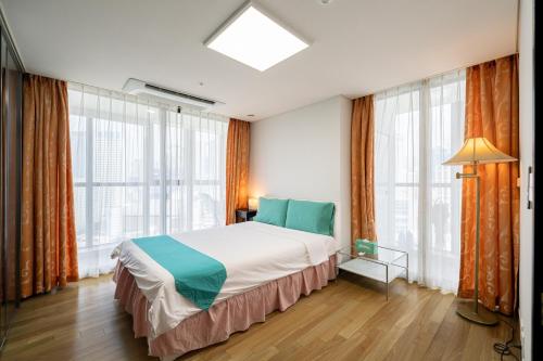 Ένα ή περισσότερα κρεβάτια σε δωμάτιο στο On the Beach for big family & Bexco