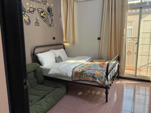 Postel nebo postele na pokoji v ubytování Kinmen Otter Wave Homestay