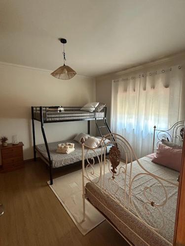 a room with a bunk bed in a room at Condinho's Guest House in Golegã