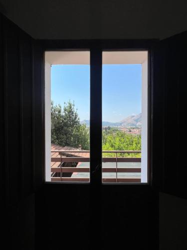a window with a view of a balcony at Azienda agricola zootecnica Soriente di Guglielmo Areh Soriente & C.S.A.S in Roccapiemonte