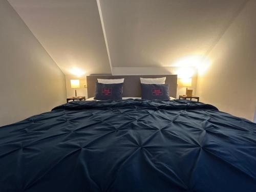 Postel nebo postele na pokoji v ubytování Hotel Am Schloss Ahrensburg